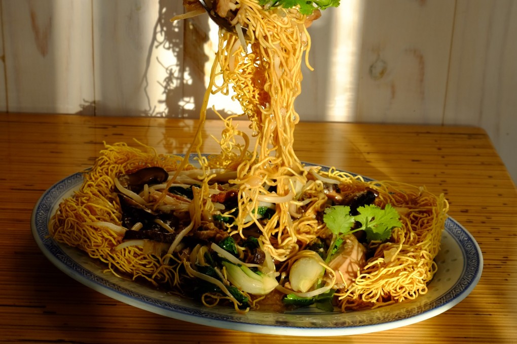 Craig Wong’s signature jerk chicken chow mein is a Jamaican-Chinese fusion with crispy egg noodles, pulled jerk chicken, shiitake, bok choy and oyster sauce. Photo: Patois Toronto