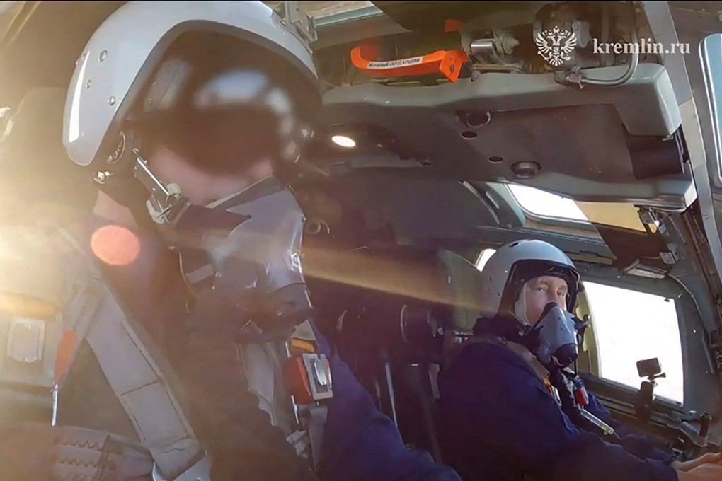 Russian President Vladimir Putin (right) sits in a Tupolev Tu-160M strategic bomber on Thursday. Photo: Russian Presidential Press Office via AFP