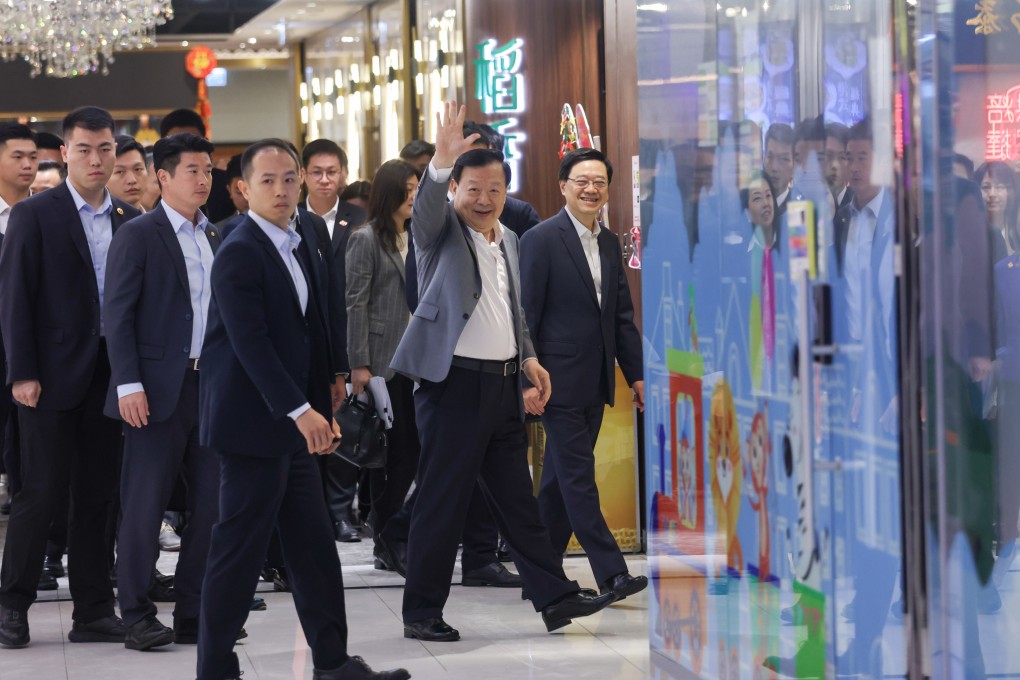 Xia Baolong (centre), director of the Hong Kong and Macau Affairs Office, and city leader John Lee (right) head to a restaurant in Tseung Kwan O for breakfast. Photo: Yik Yeung-man