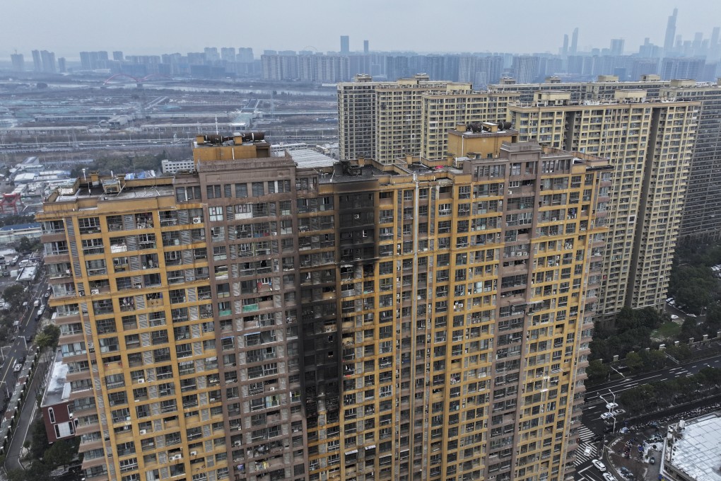 At least 15 people were killed in the residential building fire in Nanjing, Jiangsu province, on Friday. Photo: Chinatopix Via AP