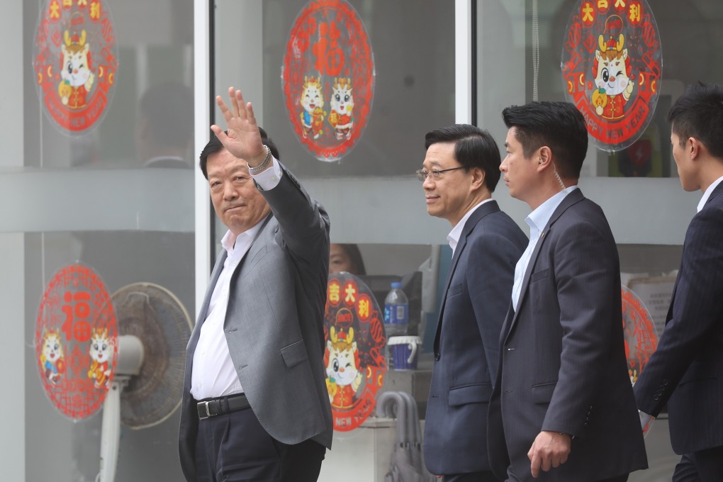 Xia Baolong (left), director of Hong Kong and Macao Affairs Office, waves to reporters. He is currently in the city on a seven-day fact-finding mission. Photo: Edmond So