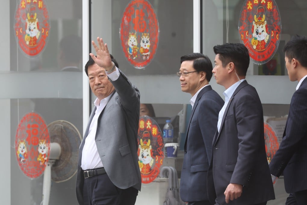 Xia Baolong (left), director of Hong Kong and Macao Affairs Office, waves to reporters. He is currently in the city on a seven-day fact-finding mission. Photo: Edmond So