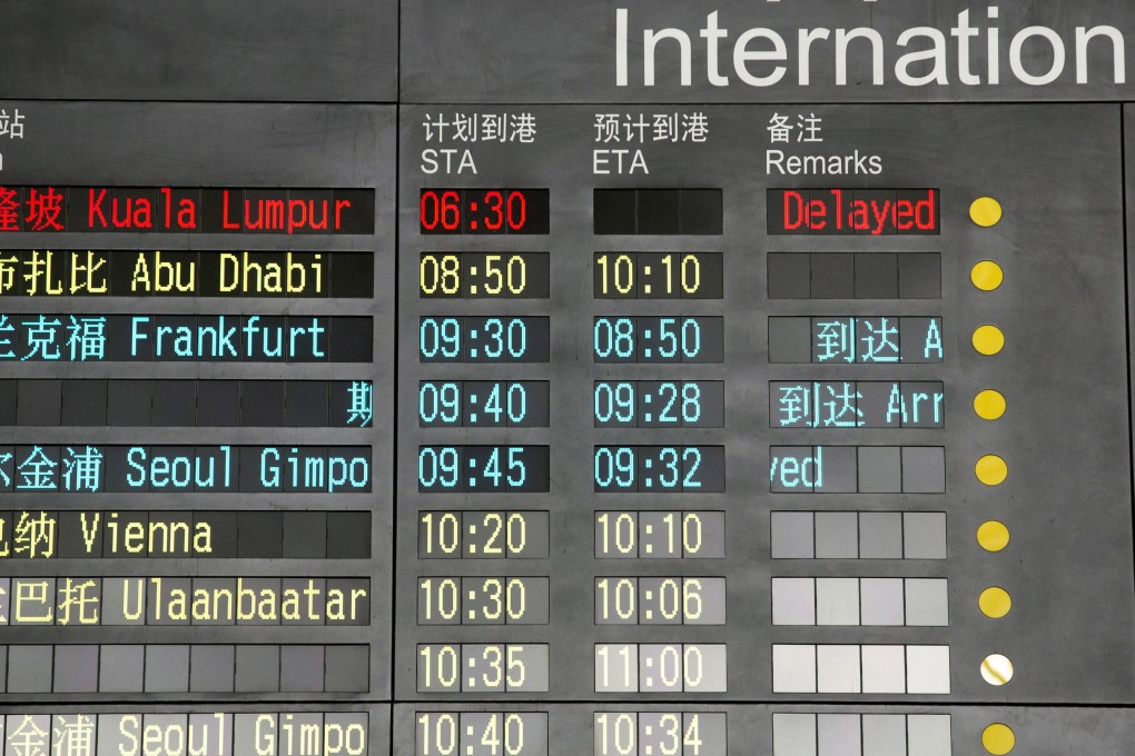 The arrival board at the International Airport in Beijing, China, shows a Malaysian airliner delayed on March 8, 2014. Photo: AP