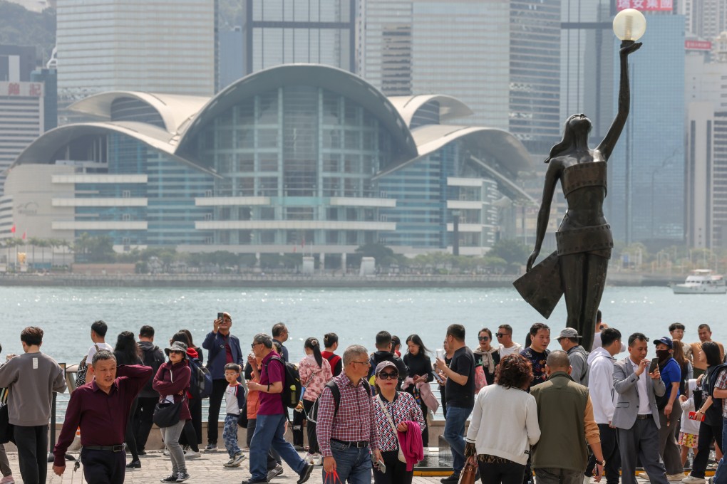 Visitors at the Avenue of Stars in Tsim Sha Tsui. The solo traveller scheme was introduced in 2003 to help the economy after the Sars epidemic. Photo: Jelly Tse