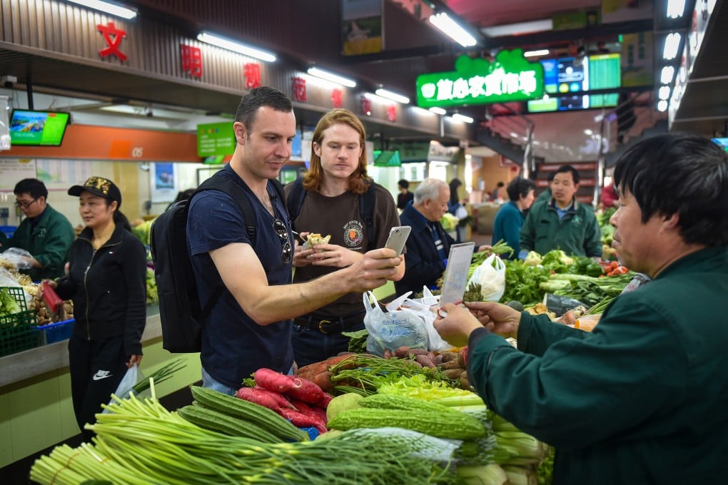 China is trying to make it easier for foreigners to use payment apps. Photo: Xinhua