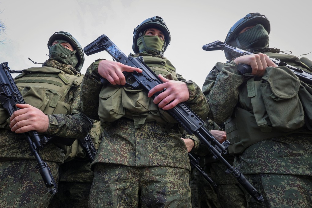 Russian soldiers attend a memorial in Crimea last week for fallen comrades killed during the war with Ukraine. Photo: Reuters