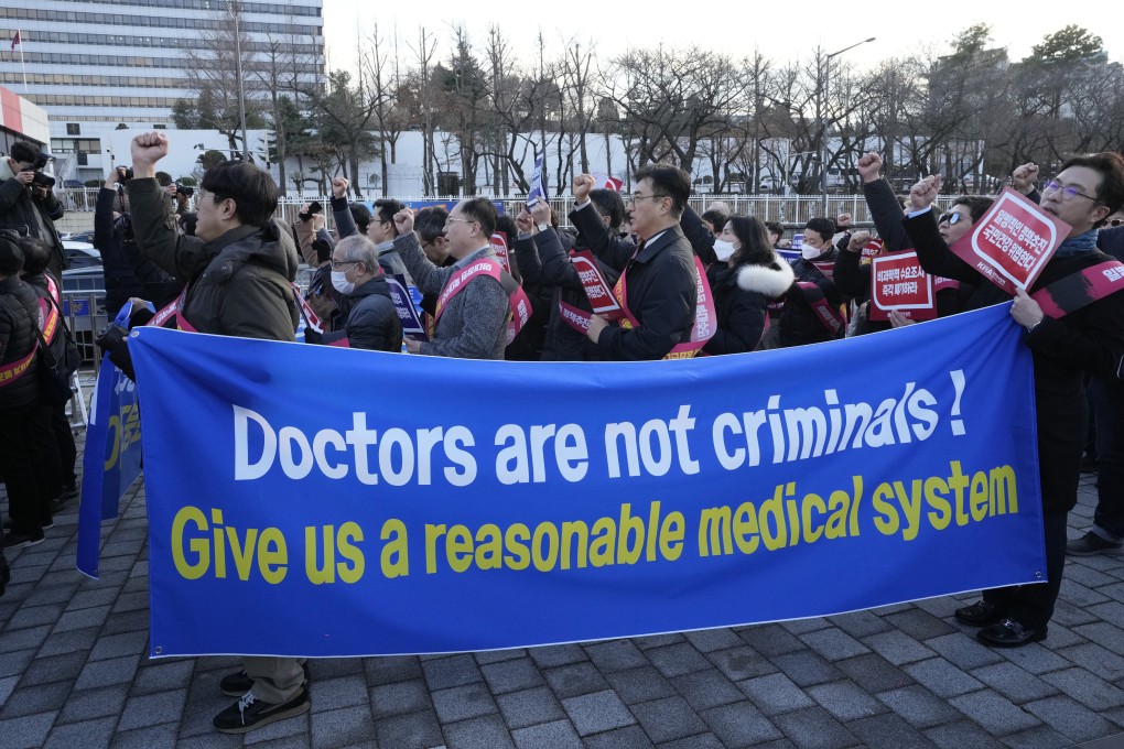 Doctors rally against the government’s medical policy near the presidential office in Seoul. Photo: AP