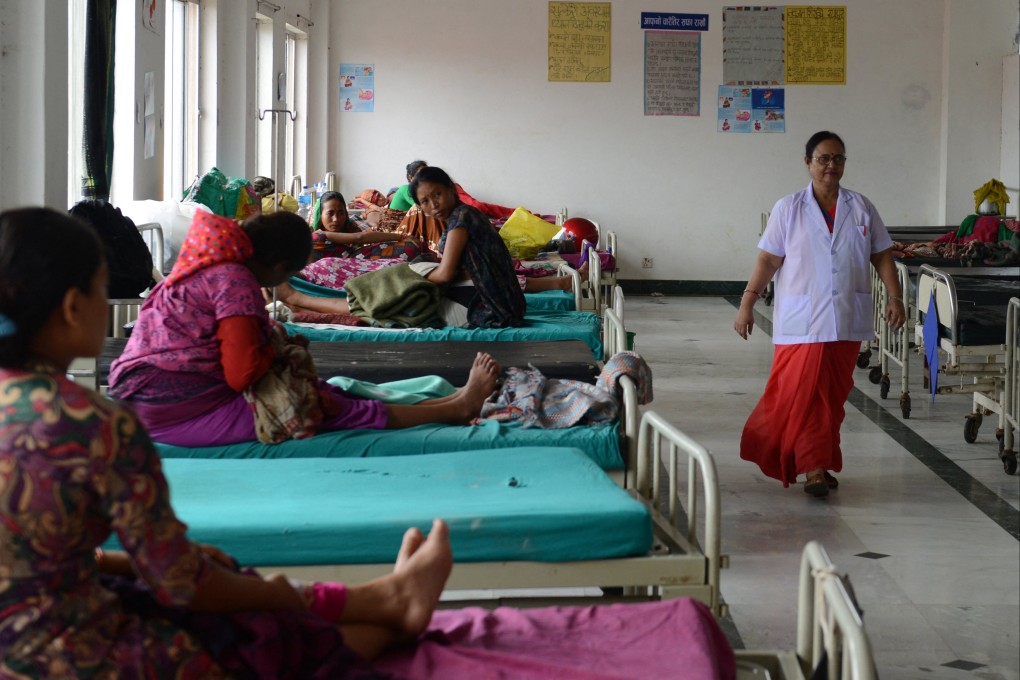 Health matron Rambha Sharma walks down a ward at the Kohalpur Teaching Hospital in the Banke District. Nepal is among 55 countries included in a World Health Organization red list of nations facing a severe shortage of healthcare workers. Photo: AFP