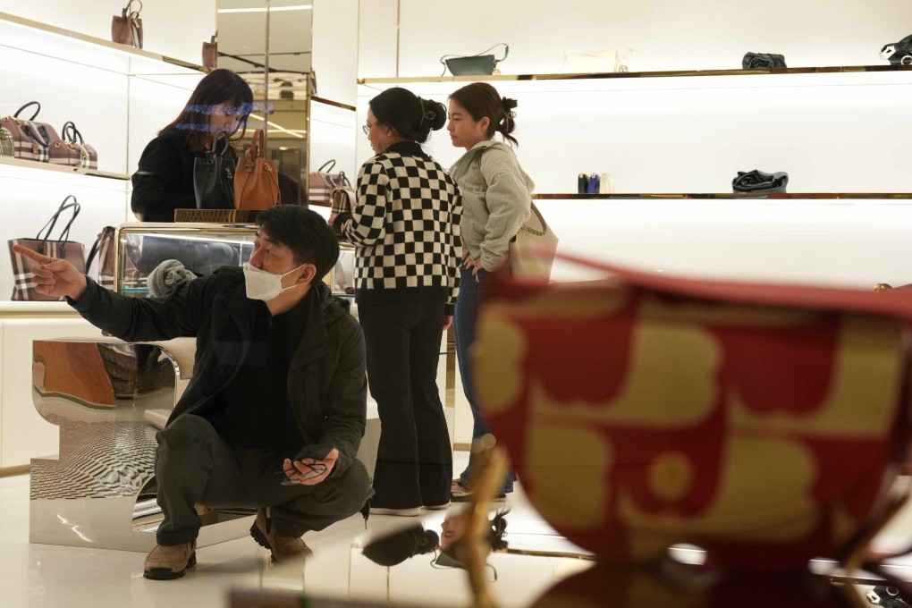 Tourists shop at a luxury store in Admiralty on February 11, over Lunar New Year. With a sluggish world economy, it isn’t a good sign if Hong Kong is still known to be an expensive city. Photo: Eugene Lee