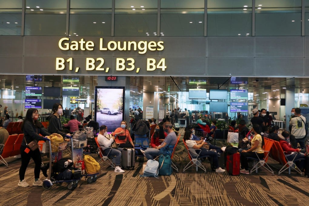 Travellers wait to embark at Changi Airport in Singapore on March 30, 2022. Photo: Reuters