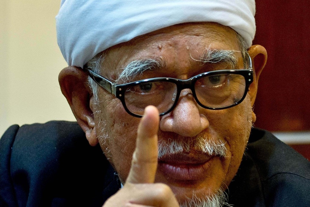 Malaysian Islamic Party (PAS) president Hadi Awang gestures during an interview at the party HQ in Kuala Lumpur in 2015. Photo: AFP