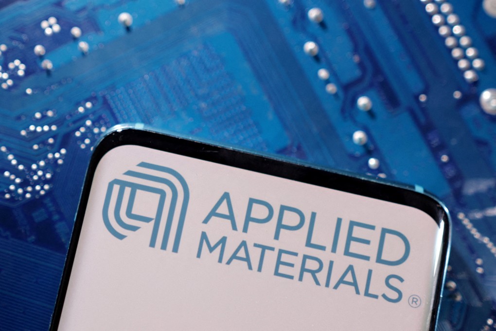 A smartphone with a displayed Applied Materials logo is placed on a computer motherboard in this illustration taken on March 6, 2023. Photo: Reuters