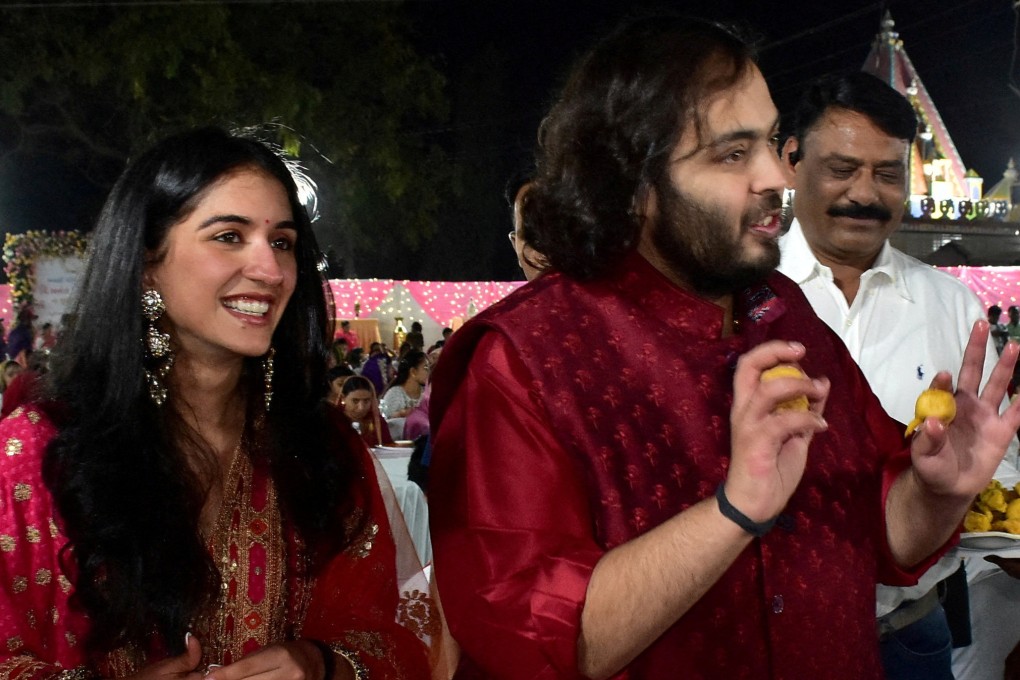 Anant Ambani, son of Mukesh Ambani, Chairman of Reliance Industries, and Radhika Merchant, daughter of industrialist Viren Merchant, serve traditional Gujarati food to villagers ahead of their pre-wedding celebrationin Gujarat, India on Wednesday. Photo: Reuters