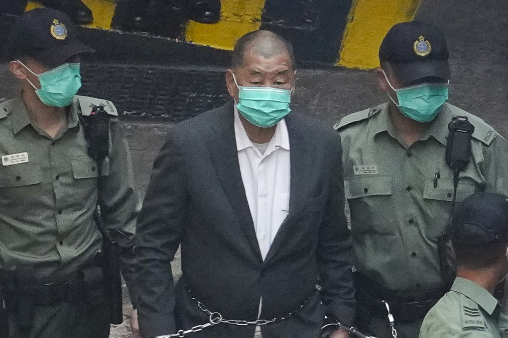 Media mogul Jimmy Lai is escorted by correctional officers at Lai Chi Kok Detection Centre in 2020. Photo: Winson Wong