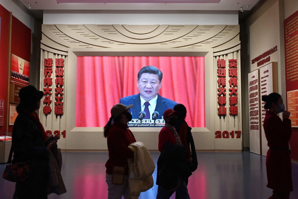Visitors walk past a video of President Xi Jinping at the Museum of the Communist Party of China in Beijing on Thursday, ahead of next week’s opening of the annual session of China’s legislature. Photo: AFP