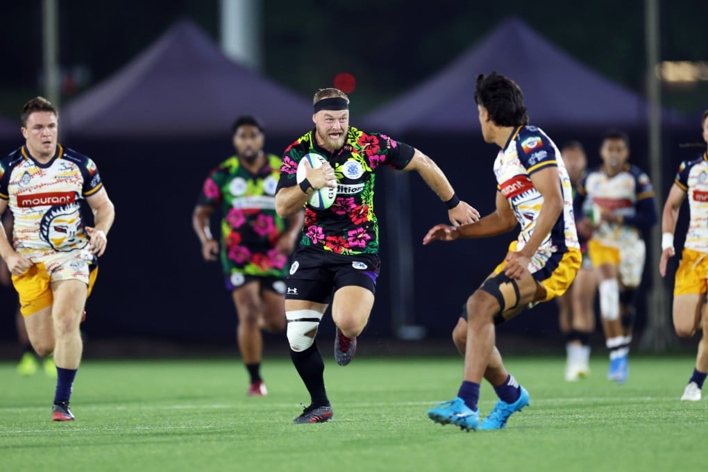 Tradition YCAC’s Curtis Reid runs at the Samurai RFC Warriors’ defence during their 2023 final at the HKFC 10s. Photo: Yik Yeung-man