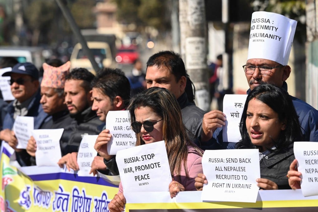 Human rights activists hold placards during a demonstration outside the Russian embassy in Kathmandu on February 5 to protest against the recruitment of Nepali nationals into the Russian army. Photo: AFP