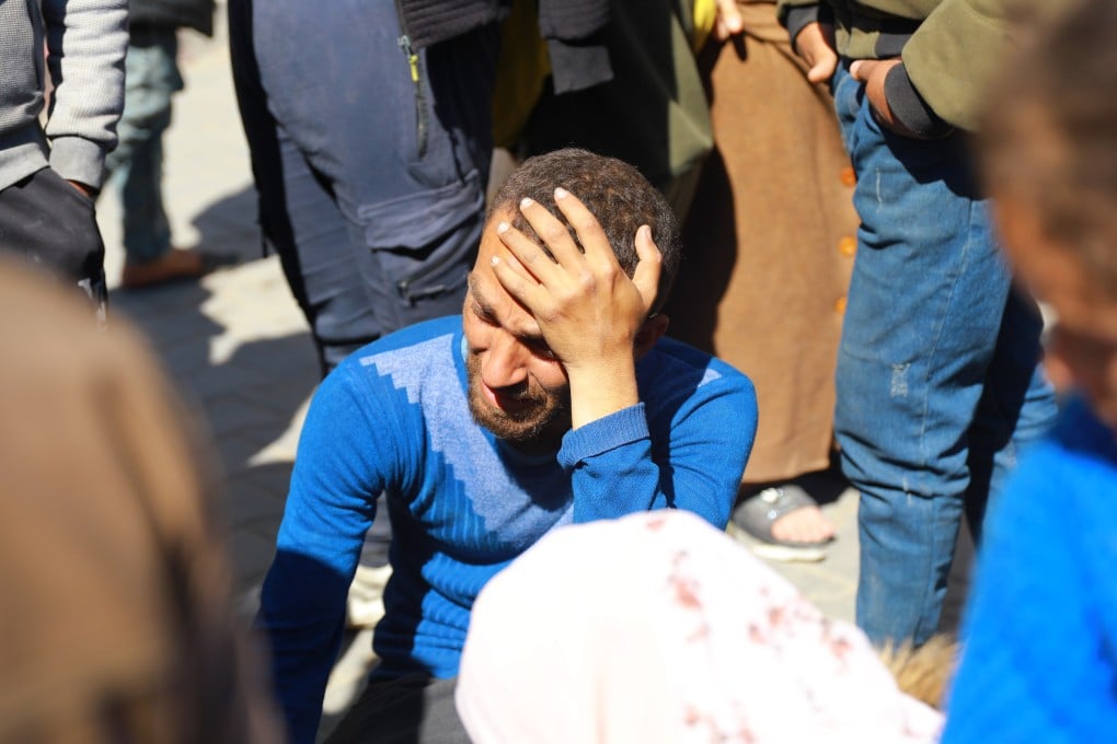 A man weeps at Al-Shifa Hospital in Gaza City after Israeli forces opened fire on a crowd of Palestinians waiting for aid on Thursday killing 104 people and wounding more than 760, Palestinian officials said. Photo: Xinhua