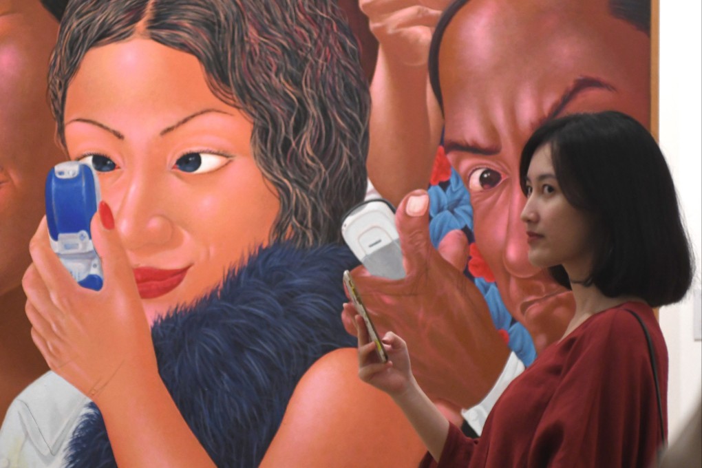 A visitor poses with an artwork on display at the Museum of Modern and Contemporary Art in Nusantara in Jakarta. Southeast Asia should be careful that its digital transformation does not replicate colonial legacies. Photo: AFP