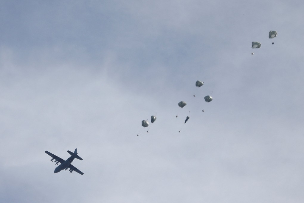 A plane drops aid over Gaza City. Photo: Reuters