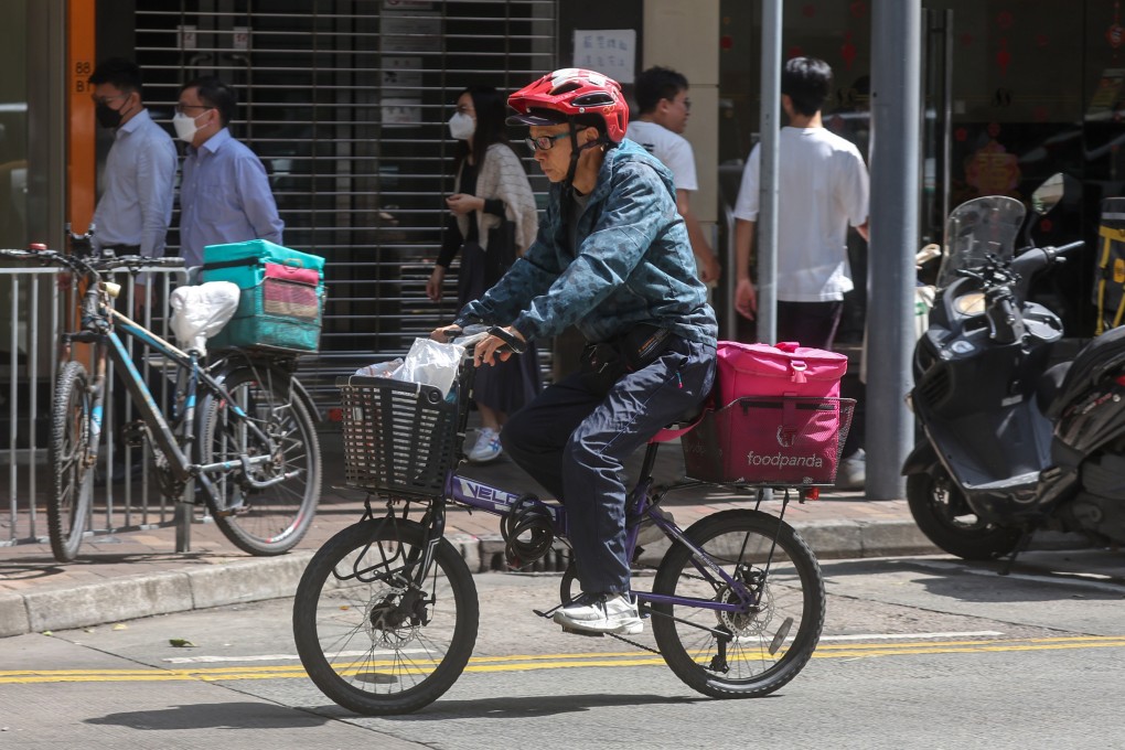 A food delivery worker in Wan Chai. Over 500 riders refused to do deliveries during the lunchtime peak period on February 26. Photo: Edmond So
