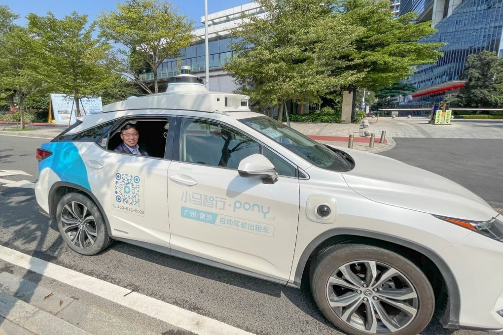 Secretary for Transport and Logistics Lam Sai-hung tries out a self-driving taxi in Guangzhou, Guangdong province, last September. Photo: ISD