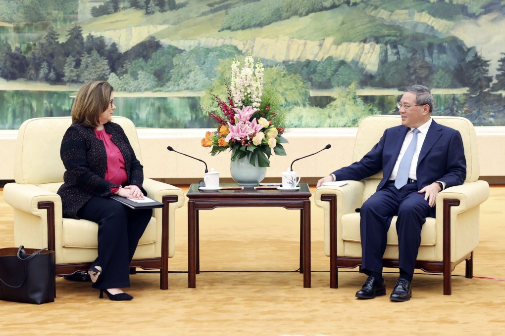 Chamber of Commerce chief executive Suzanne Clark and Chinese Premier Li Qiang at the Great Hall of the People in Beijing on Wednesday. Photo: Xinhua