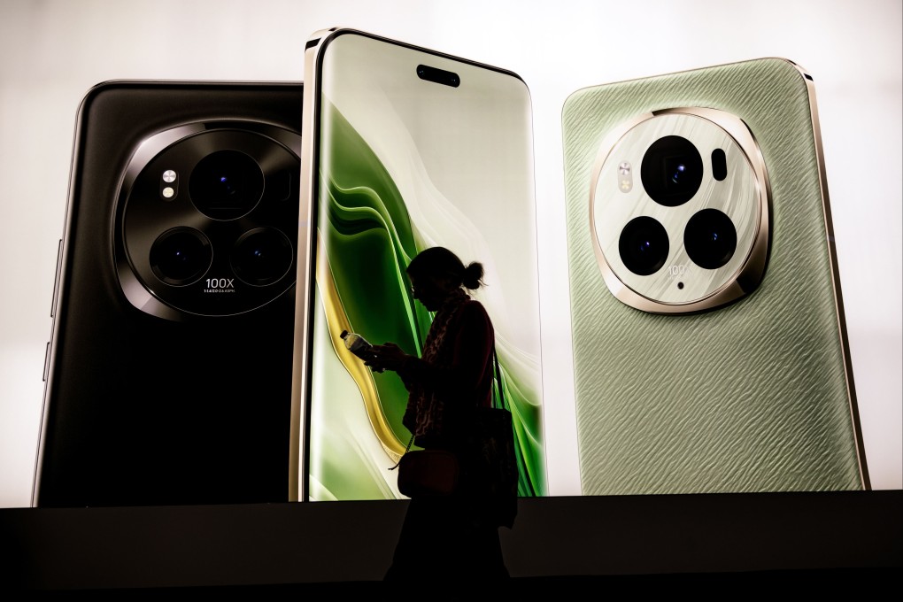 A visitor walks past Honor’s advertising for the new artificial intelligence-enabled Magic6 Pro Android smartphone at trade show MWC Barcelona on February 26, 2024. Photo: dpa