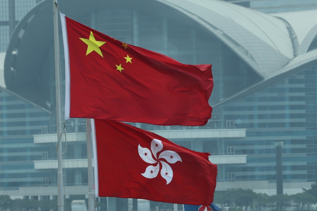 The Chinese flag and the flag of the HKSAR fly outside the Hong Kong Convention and Exhibition Centre. Photo: Jelly Tse