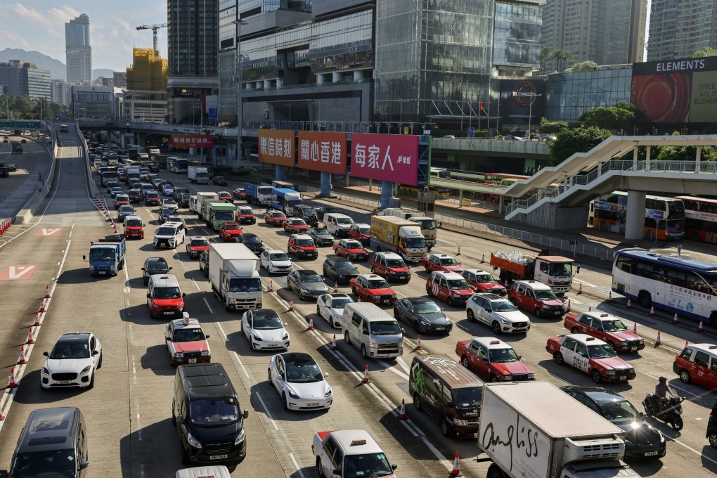 Vehicles heading to a cross-harbour tunnel. Wealthy buyers of top-end EVs are unlikely to be deterred by the reduced tax breaks, industry players say. Photo: May Tse