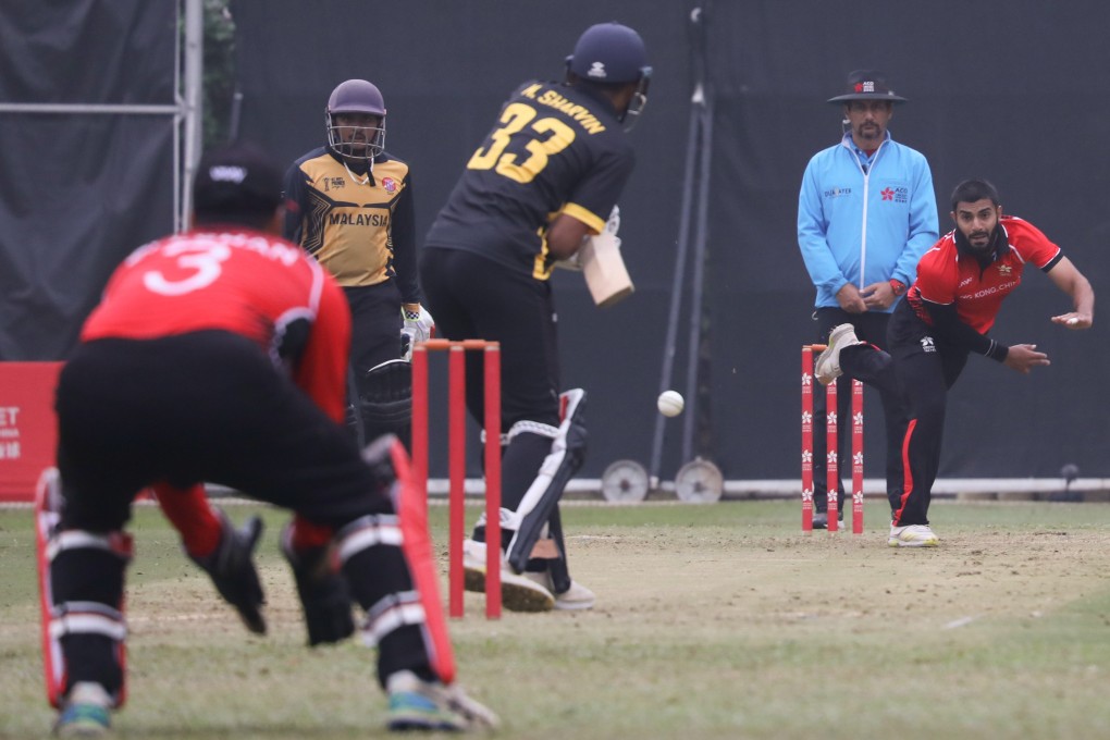 Hong Kong’s Haroon Arshad bowls during a game against Malaysia at Tin Kwong Road Recreation Ground. Photo: Xiaomei Chen