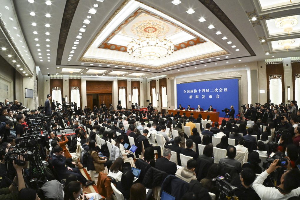CPPCC spokesman Liu Jieyi takes questions from the media at the Great Hall of the People in Beijing on Sunday. Photo: XInhua