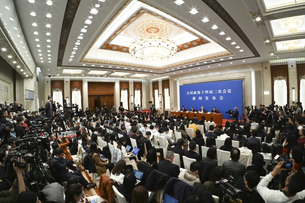 CPPCC spokesman Liu Jieyi takes questions from the media at the Great Hall of the People in Beijing on Sunday. Photo: XInhua