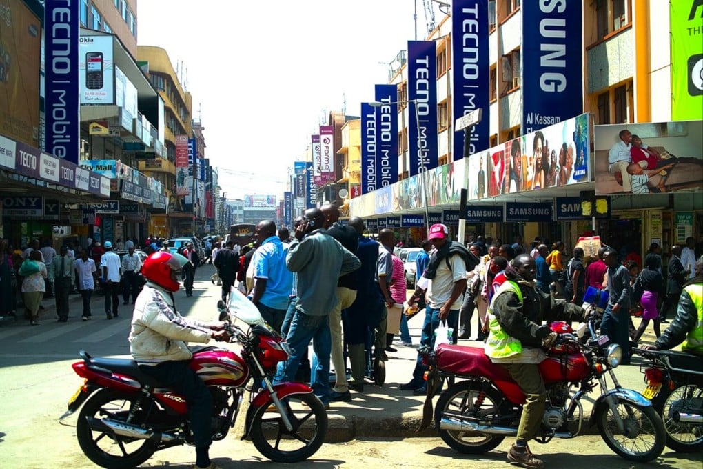 Adverts for the market-leading Chinese phone brand Tecno compete for customers’ attention along with rival brands along Luthuli Avenue in the Kenyan capital Nairobi. Photo: Weibo/品玩