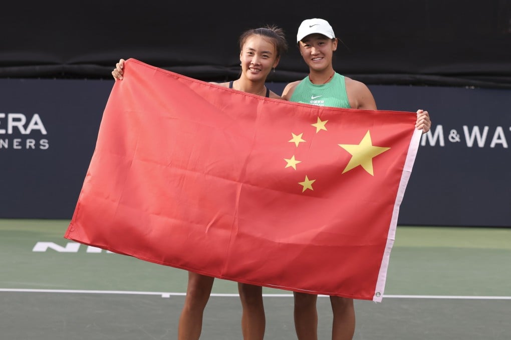 Yuan Yue (left) and Wang Xiyu pose with the Chinese flag after their final in Austin. Photo: EPA-EFE