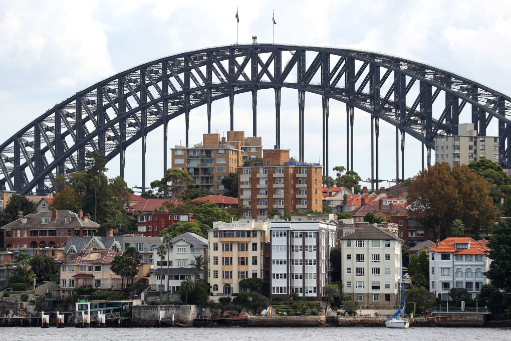 Residential buildings are seen in Sydney in March 2022. Australia’s housing market is increasingly unaffordable for first-time buyers and renters, but its appeal to foreign investors remains intact. Photo: Bloomberg