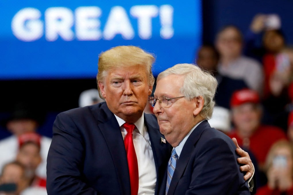 Donald Trump hugs Senator Mitch McConnell at a campaign rally in Lexington, Kentucky, in November 2019. Photo: Reuters