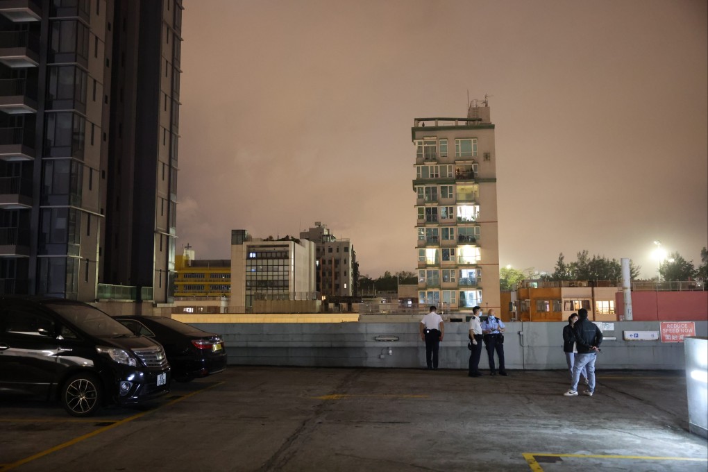 Police examine the rooftop shopping centre car park where a father and son, aged seven, plunged to the ground. Photo: Handout
