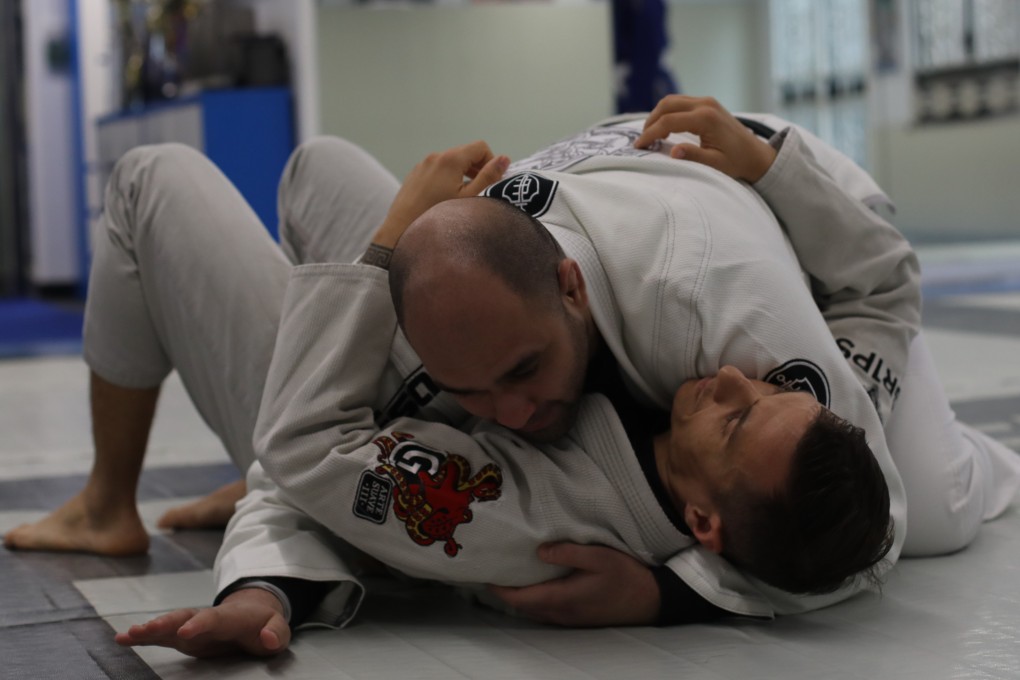 Nosherwan Khanzada (top) demonstrates during a class at his gym in Sheung Wan. Photo: Xiaomei Chen