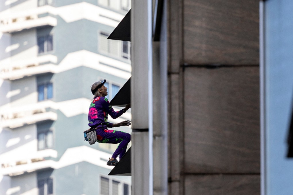 Urban climber Alain Robert, also known as the “French Spider-Man” climbs the GT Tower in Manila on Tuesday. Photo: Reuters