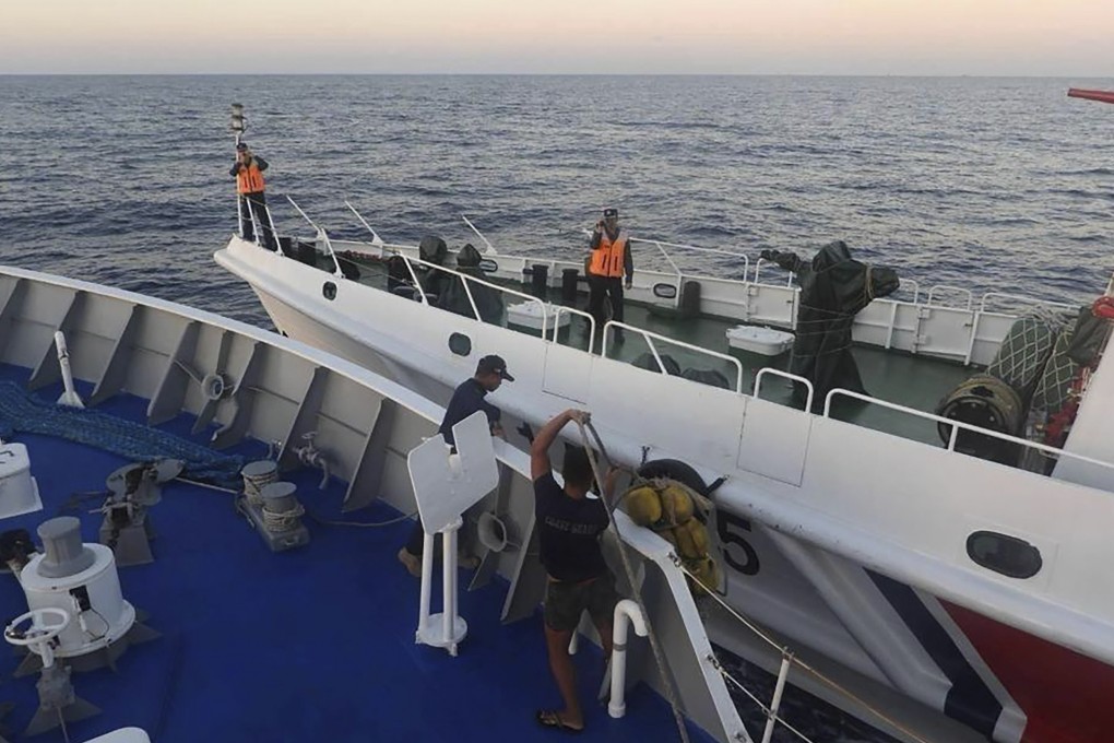 A Chinese coastguard ship approaches a Philippine coastguard vessel (foreground), causing a minor collision, in the vicinity of Second Thomas Shoal on March 5. Photo: Philippine coastguard via AP