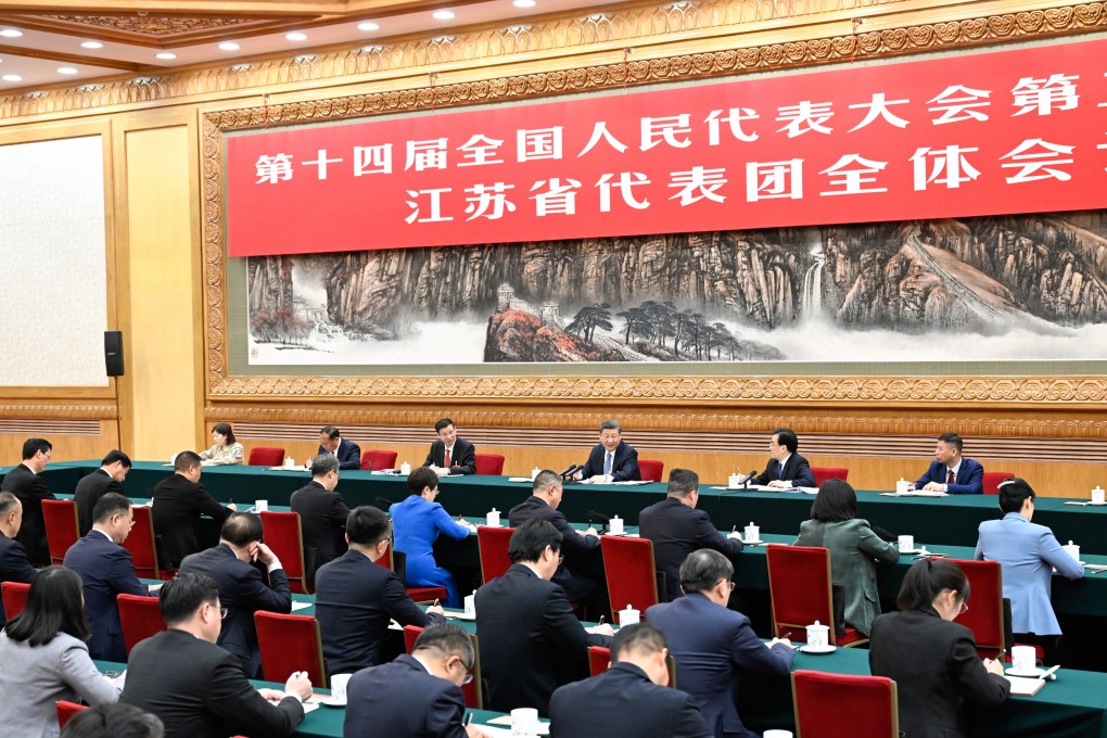 President Xi Jinping takes part in a deliberation with his fellow deputies from the delegation of Jiangsu province. Photo: Xinhua