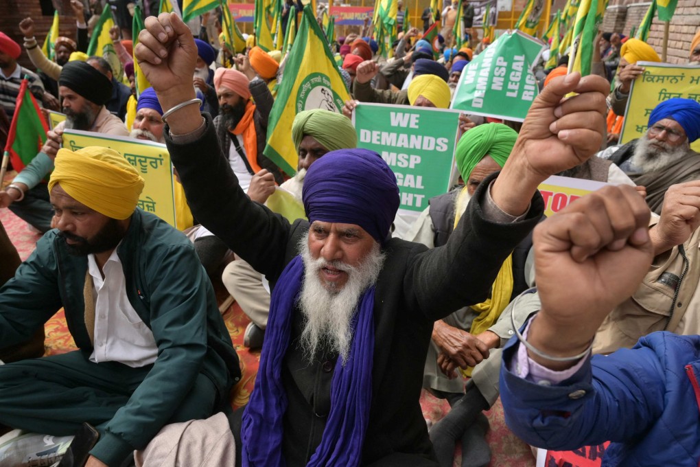 Farmers shout slogans during a protest against India’s central government to demand minimum crop prices in Amritsar on Tuesday. Photo: AFP