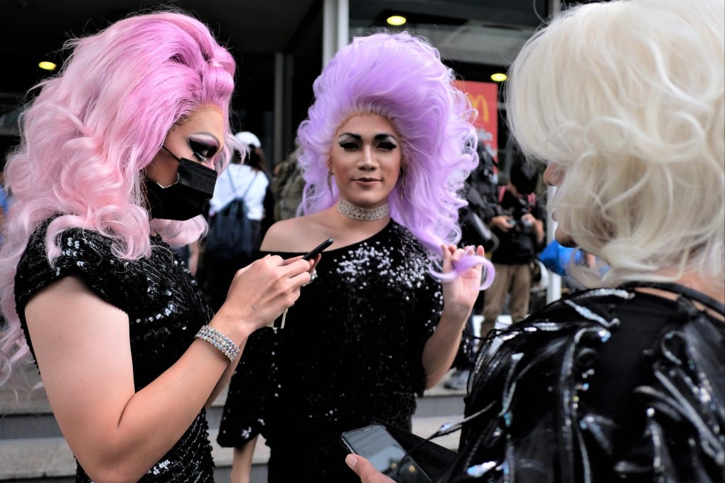 Ladyboys, as transwomen are called in Thailand, stand on a street in central Bangkok. Thai transgender people have issued a rallying cry to their compatriots on social media, with nationalism-tinged posts urging them to assemble outside the hotel where the Filipinos were staying. Photo: Tibor Krausz