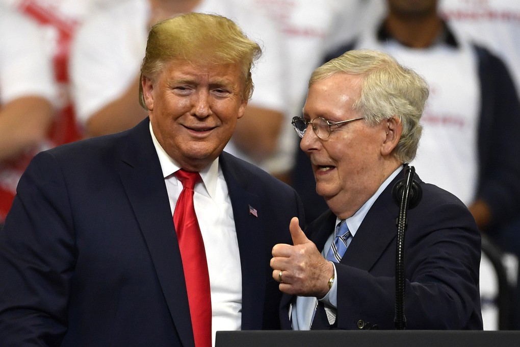 Then US President Donald Trump (left) and Republican Senator Mitch McConnell greet each other during a campaign rally in Lexington, Kentucky, in November 2019. Photo: AP