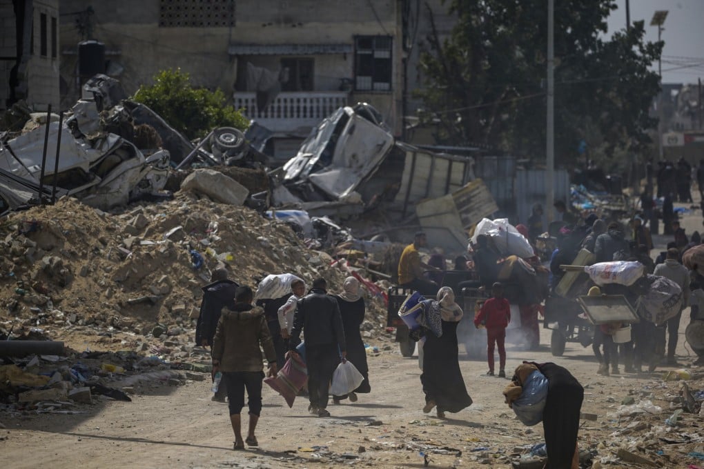 Palestinians surrounded by the rubble of destroyed buildings following an Israeli military operation in Khan Younis in the southern Gaza Strip. Photo: EPA-EFE