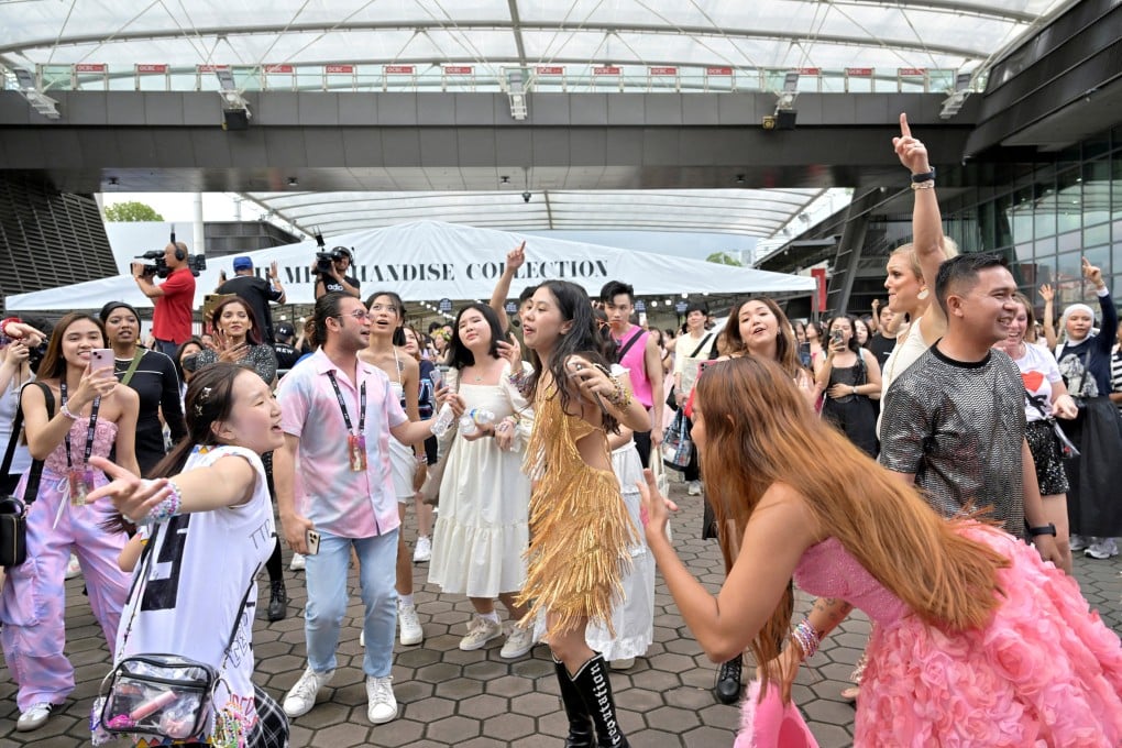 Fans of singer Taylor Swift dance to her music at the National Stadium during a concert in Singapore on March 2. Photo: Reuters