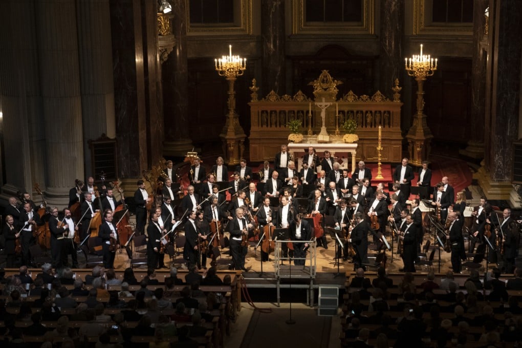 Members of the Vienna Philharmonic after a performance in Berlin Cathedral. The orchestra, which was all male until 1997, now has 24 woman players. Photo: Getty Images