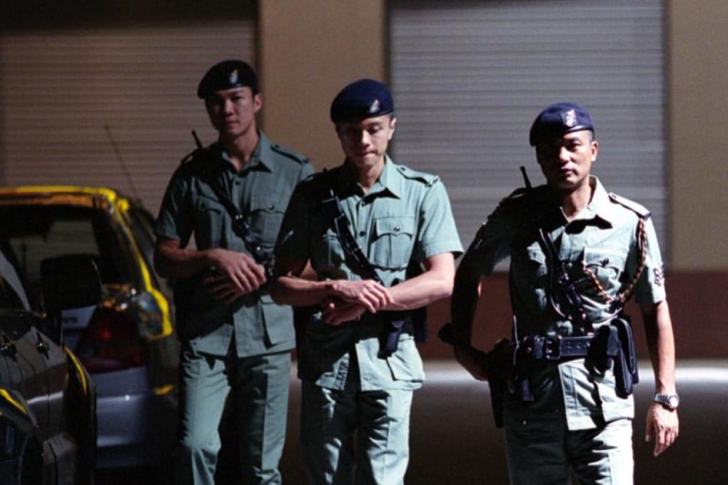 Simon Yam (right) in a still from PTU, one of two game-changing Johnnie To films made in the early 2000s that stood out for their action sequences, taut storytelling and Hollywood production values. Photo: SCMP