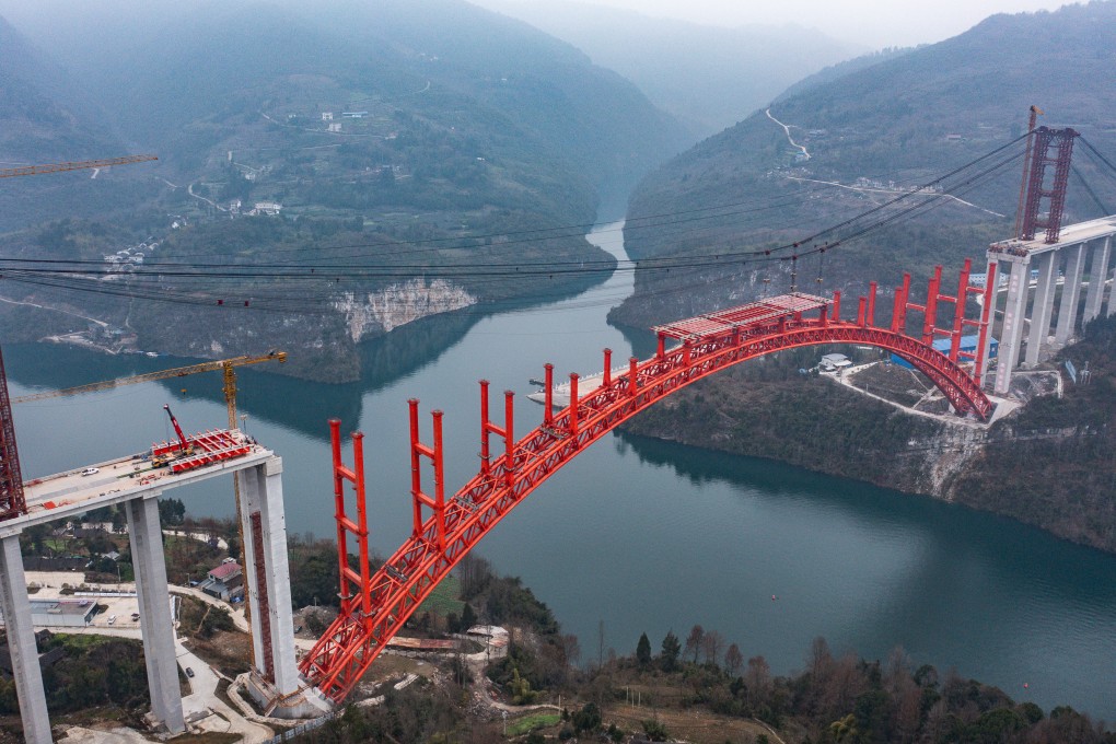 The massive Wujiang grand bridge is seen under construction in China’s Guizhou province last month. Large-scale infrastructure projects over the past decade have put many local governments heavily in debt. Photo: Xinhua